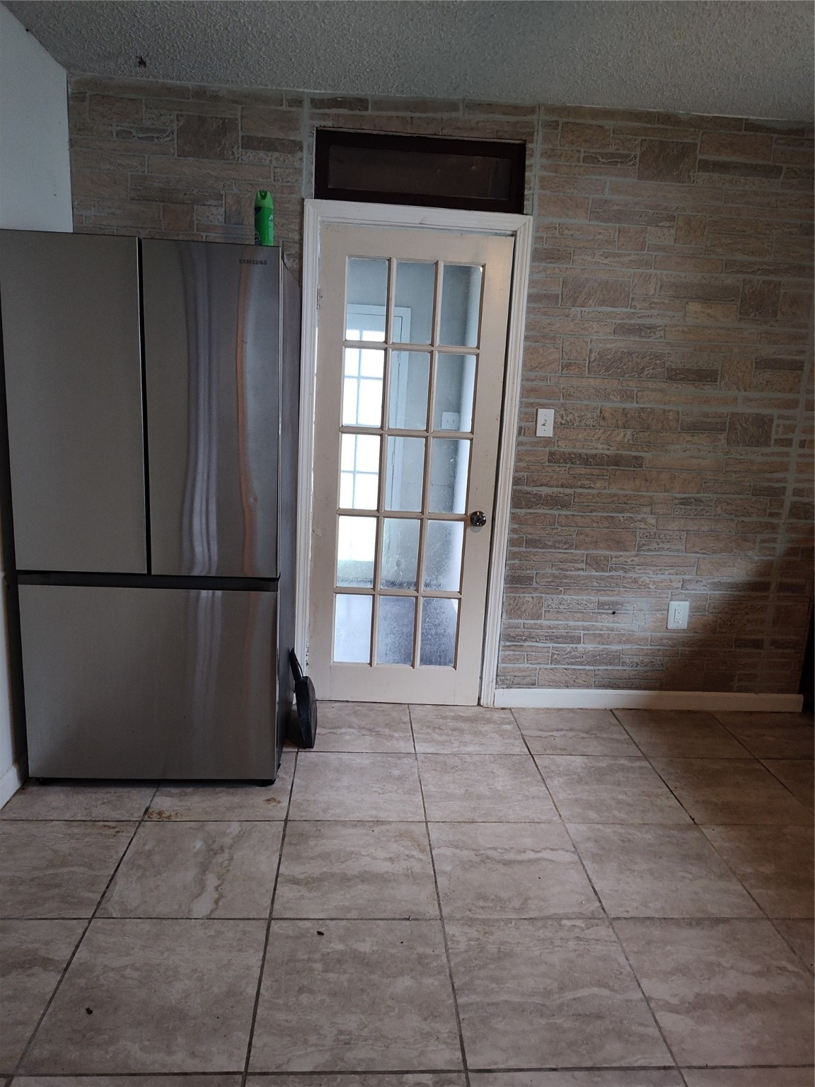 527 West 6th Street Freeport, TX 77541 - Photo 7 of 25 a view of an empty room with window and stairs