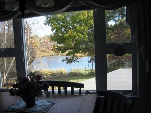 22 Benedict Road Bourne, MA 02532 - Photo 5 of 21 a view of a balcony with chairs and a table