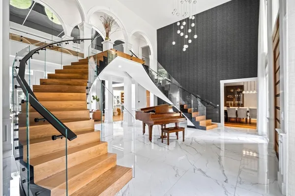 an aerial view of residential house with outdoor space and swimming pool