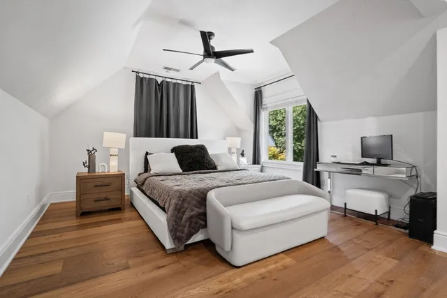 a view of a house with a big yard plants and large trees