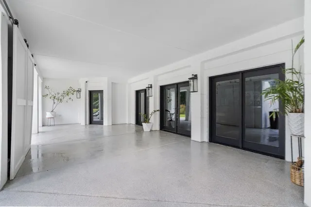 an aerial view of residential house with outdoor space and swimming pool