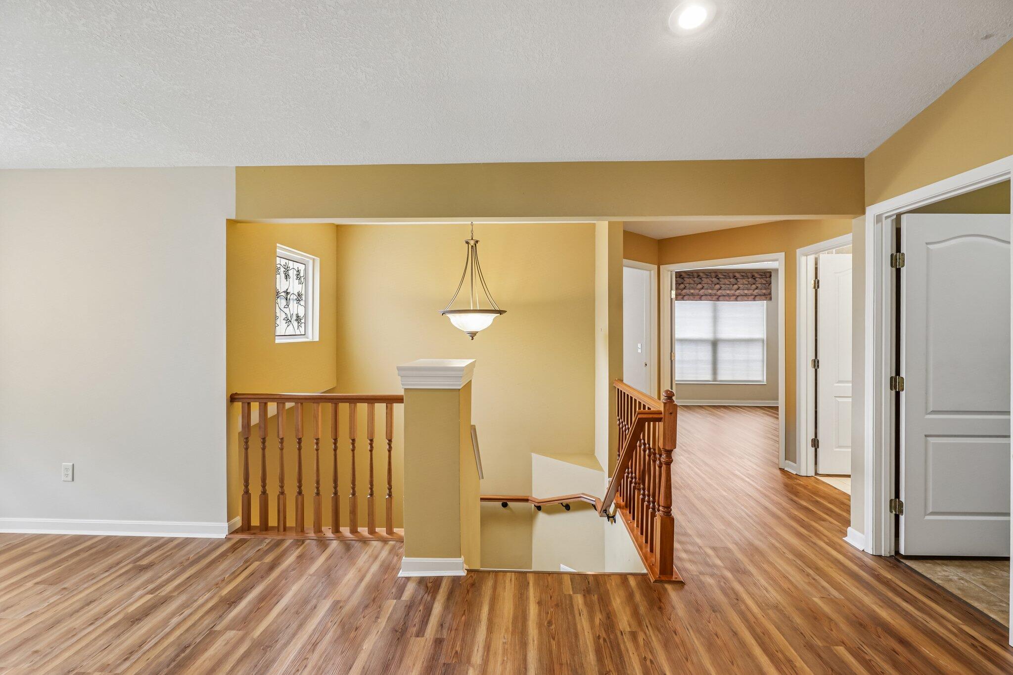 876 Flint Ridge Newport, KY 41076 - Photo 13 of 43 Expansive interior featuring wood-finish flooring, a decorative chandelier, recessed lighting, and white paneled doors