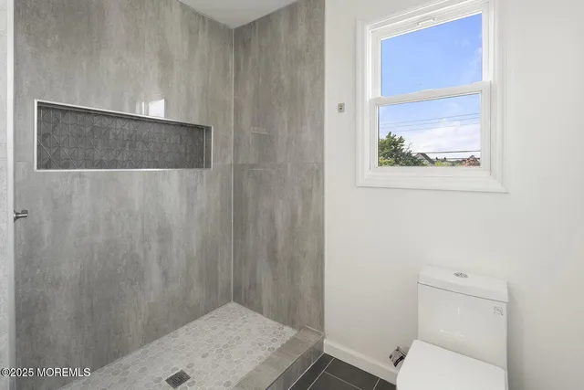 a bathroom with a toilet and a sink