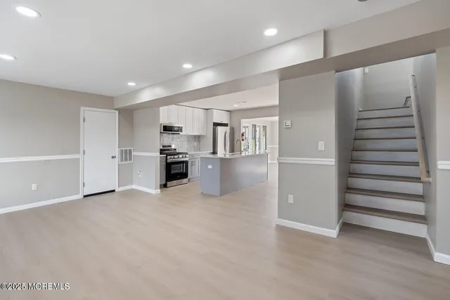 a view of a kitchen with a sink and an oven