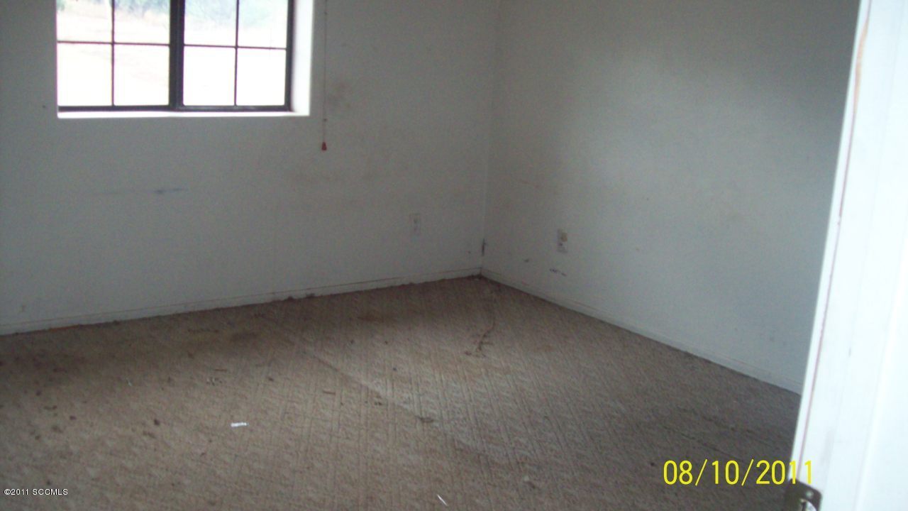 133 Uni Lane Rio Rico, AZ 85648 - Photo 6 of 6 an empty room with a window