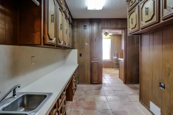 a view of a kitchen cabinets and a wooden floor