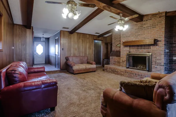 a kitchen with stainless steel appliances a stove a sink and a microwave