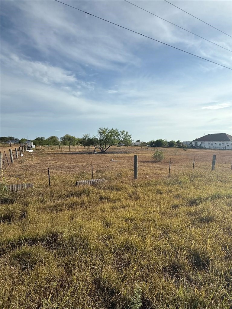 0 County Road 24 Road Robstown, TX 78380 - Photo 2 of 4 a view of a lake with houses in the back