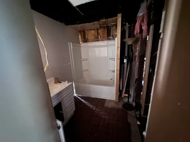 a view of an empty room with a fireplace