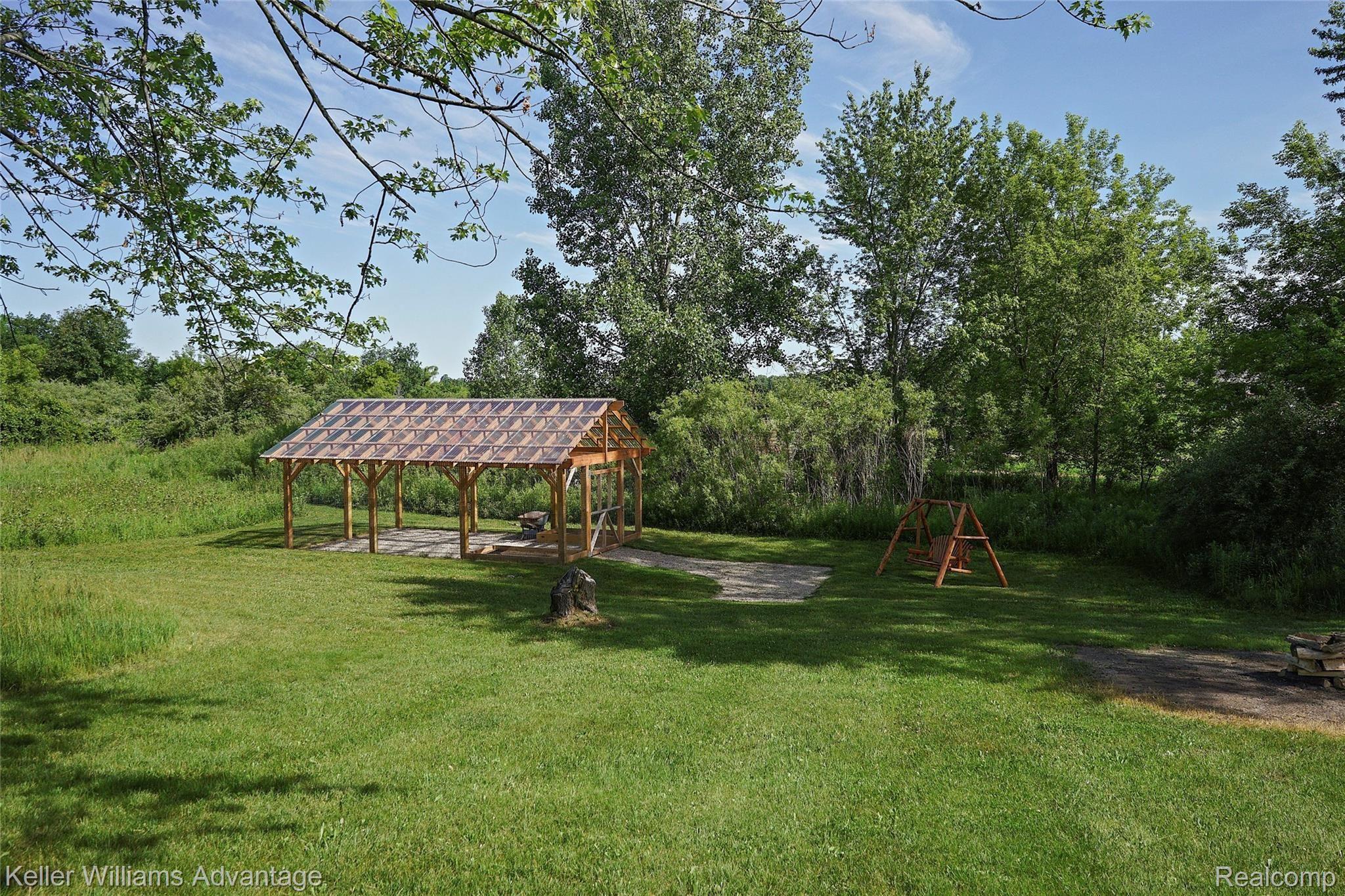 944 Chase Lake Road Howell, MI 48855 - Photo 33 of 36 Open-air greenhouse / garden, fenced in to keep the critters out.