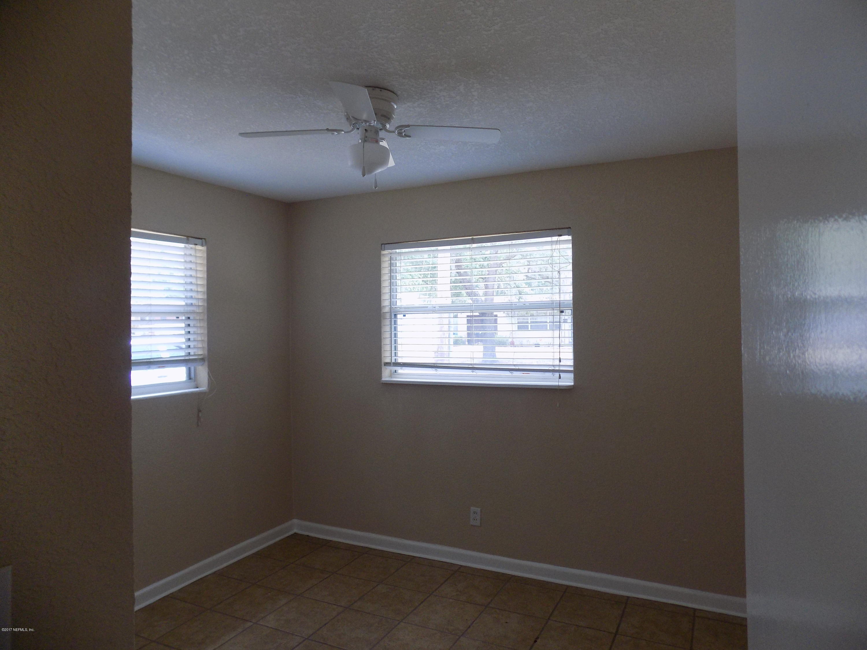 3738 Rogero Road Jacksonville, FL 32277 - Photo 11 of 22 an empty room with a window