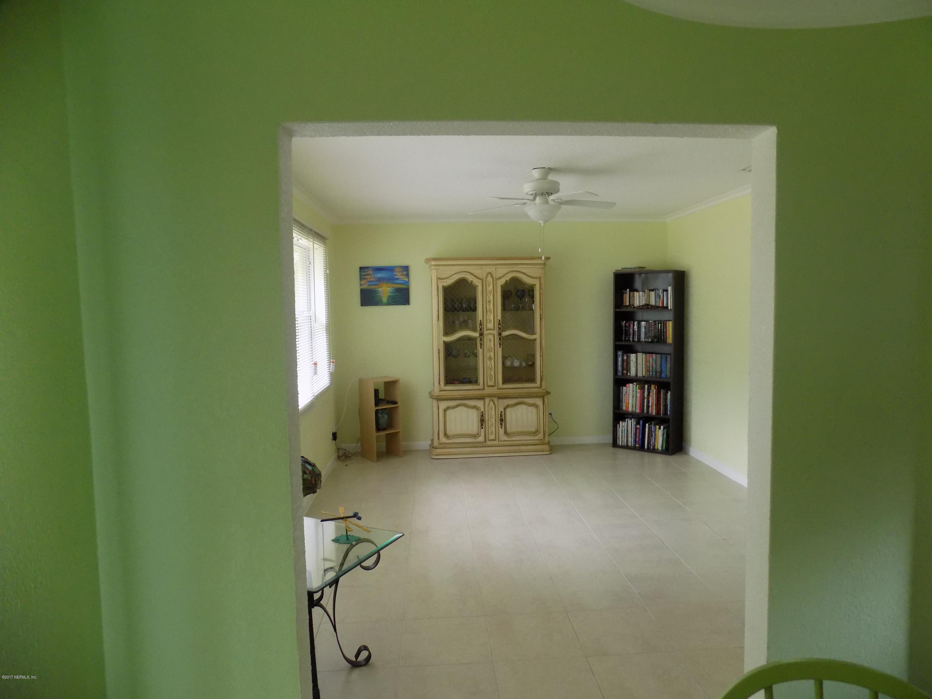 3738 Rogero Road Jacksonville, FL 32277 - Photo 4 of 22 a view of livingroom with furniture and windows
