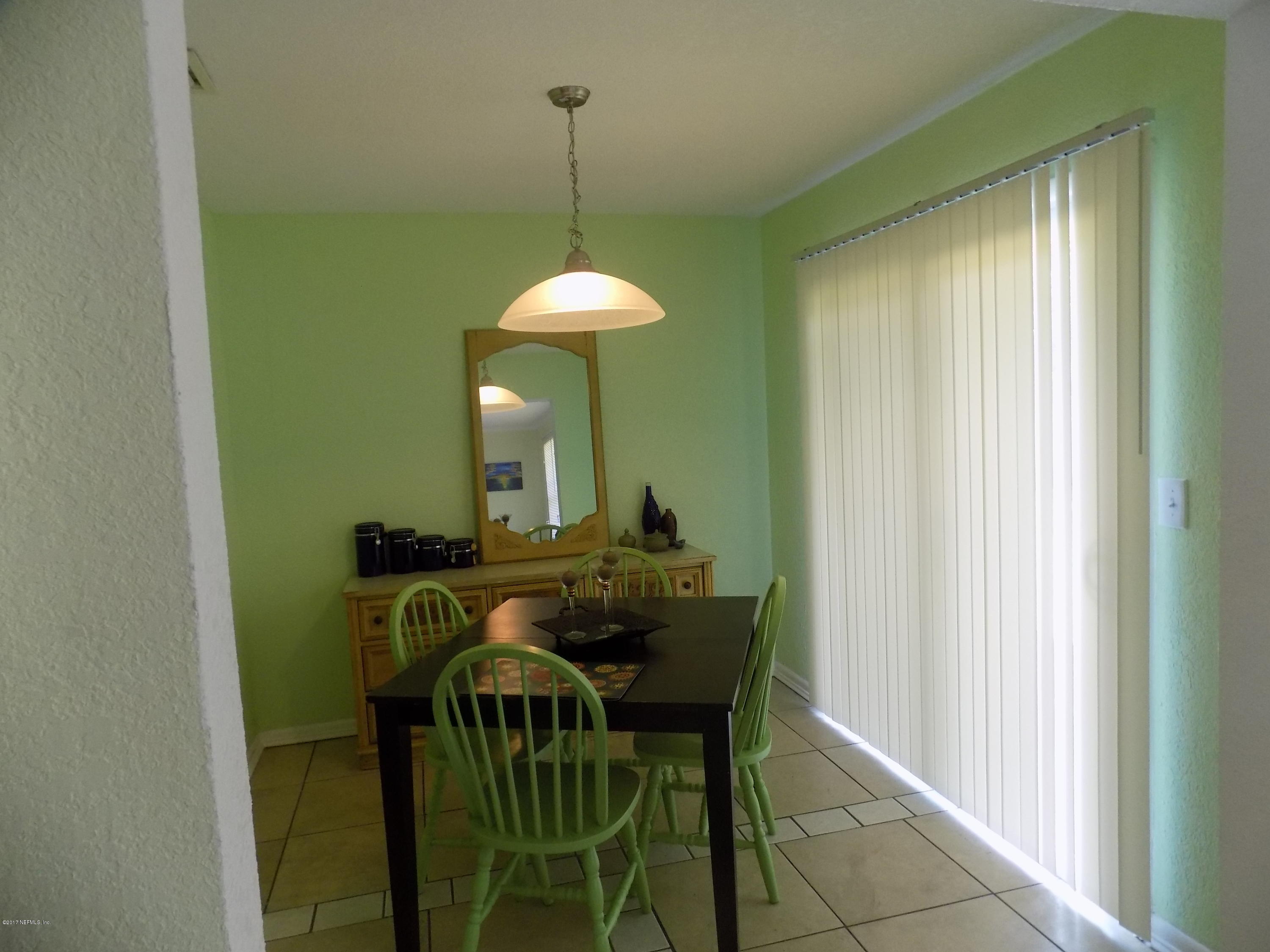 3738 Rogero Road Jacksonville, FL 32277 - Photo 6 of 22 a view of a dining room and a table chairs