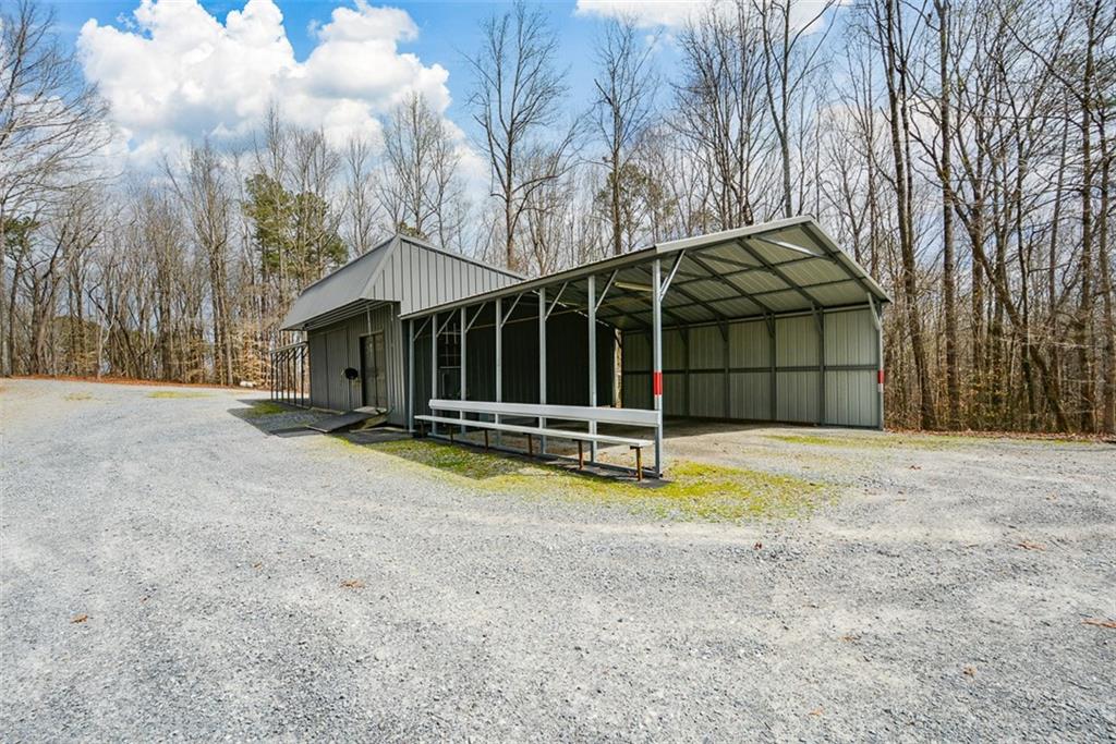 883 Tilley Road Talking Rock, GA 30175 - Photo 11 of 88 a view of a house with a yard and wooden fence