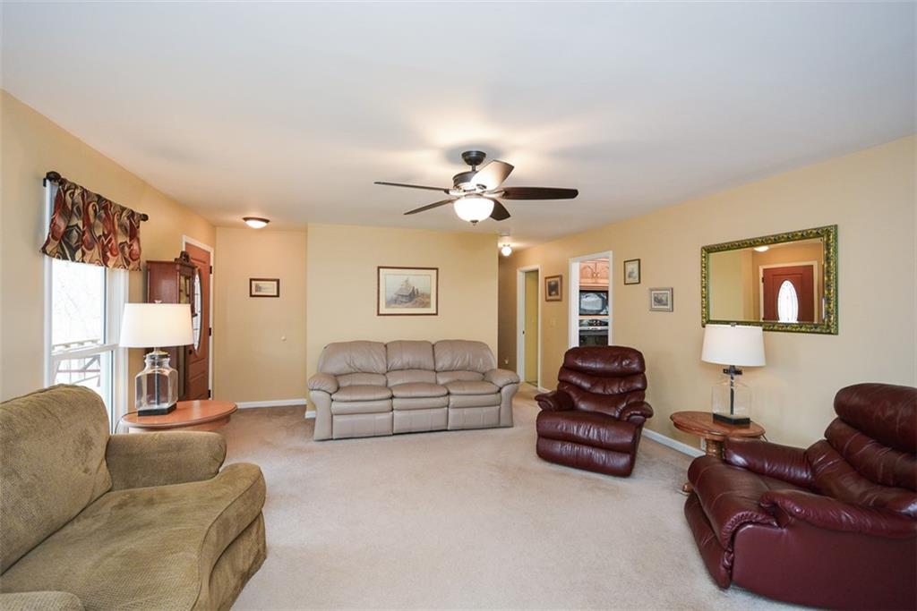 883 Tilley Road Talking Rock, GA 30175 - Photo 21 of 88 a living room with furniture ceiling fan and a window