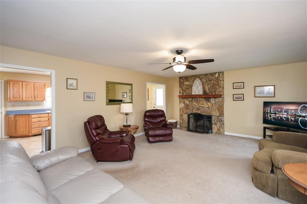 883 Tilley Road Talking Rock, GA 30175 - Photo 23 of 88 a living room with furniture a fireplace and a flat screen tv