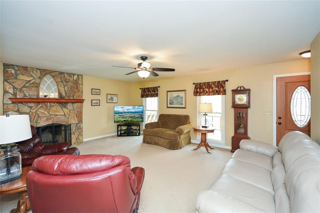 883 Tilley Road Talking Rock, GA 30175 - Photo 24 of 88 a living room with furniture and a fireplace