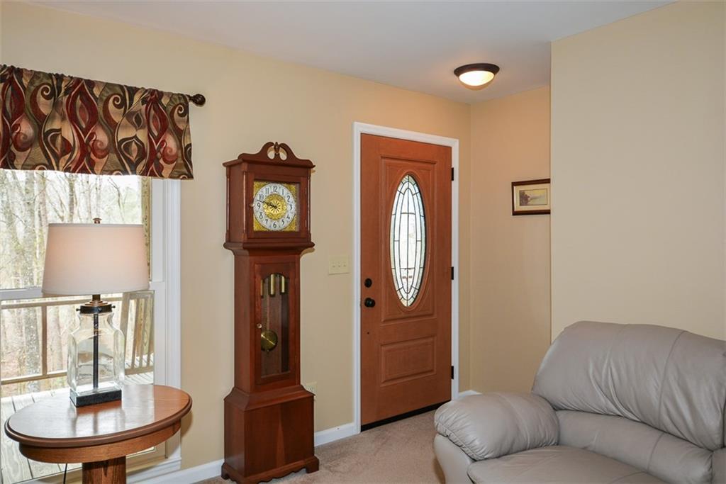 883 Tilley Road Talking Rock, GA 30175 - Photo 25 of 88 a living room with furniture and a mirror