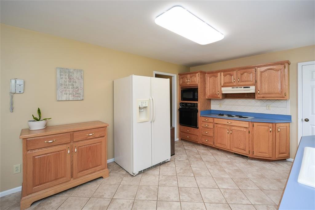 883 Tilley Road Talking Rock, GA 30175 - Photo 27 of 88 a kitchen with stainless steel appliances a refrigerator sink and cabinets