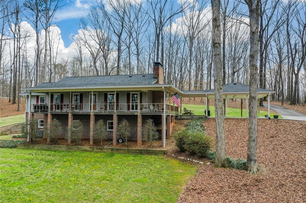 883 Tilley Road Talking Rock, GA 30175 - Photo 3 of 88 a view of an house with backyard space and balcony