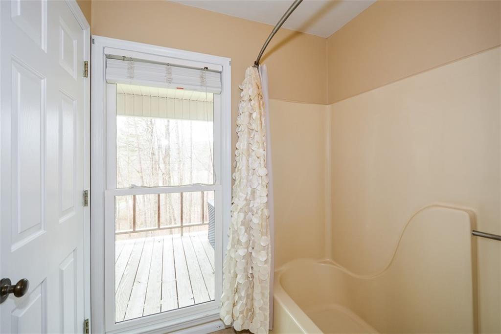 883 Tilley Road Talking Rock, GA 30175 - Photo 42 of 88 a bathroom with a bathtub and shower