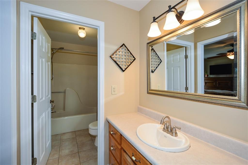 883 Tilley Road Talking Rock, GA 30175 - Photo 44 of 88 a bathroom with a sink a toilet and a shower