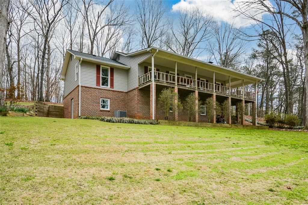 883 Tilley Road Talking Rock, GA 30175 - Photo 5 of 88 a view of a house with a yard