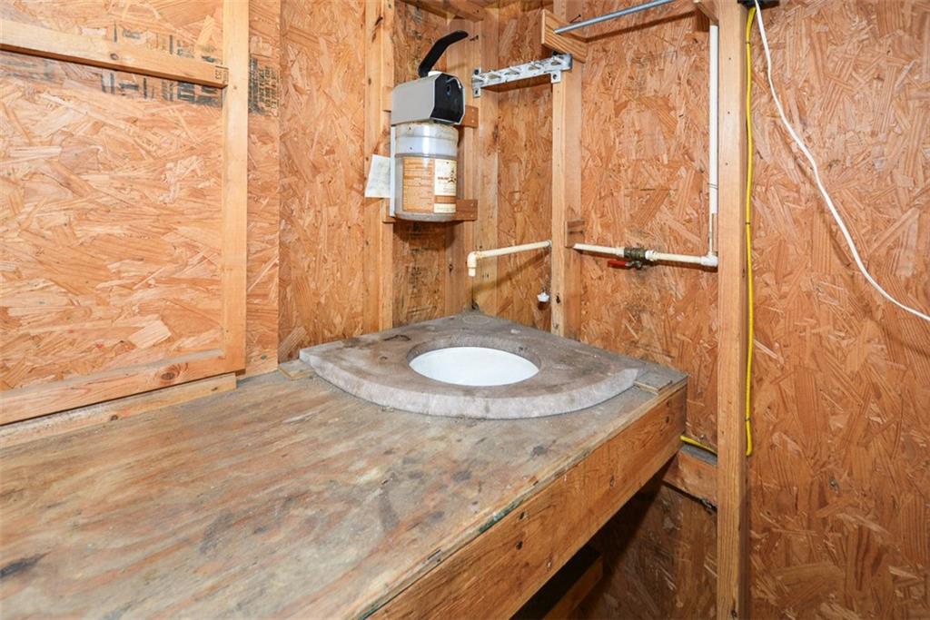 883 Tilley Road Talking Rock, GA 30175 - Photo 65 of 88 a bathroom with a sink and a mirror