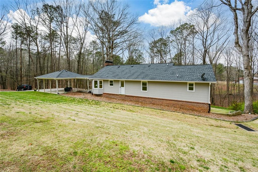 883 Tilley Road Talking Rock, GA 30175 - Photo 70 of 88 a front view of a house with garden