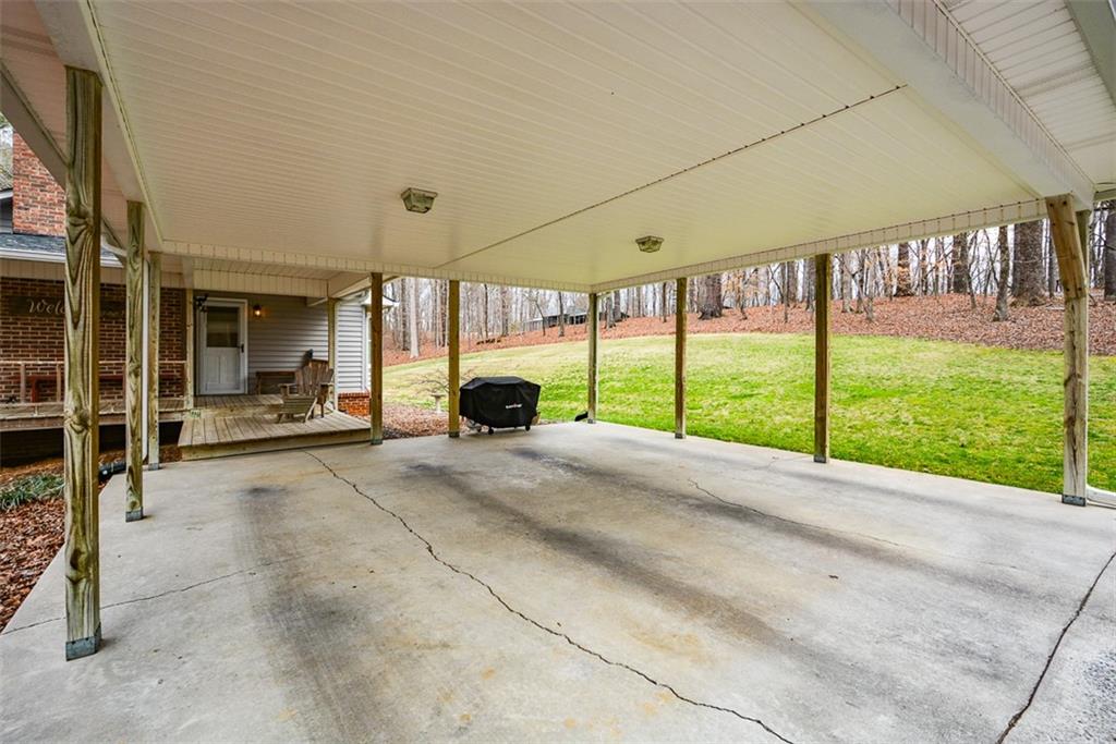 883 Tilley Road Talking Rock, GA 30175 - Photo 8 of 88 a view of a porch with furniture and a yard