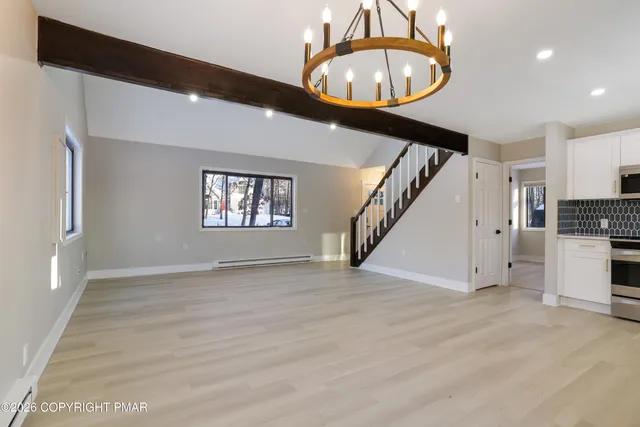 a kitchen with a sink stove and refrigerator