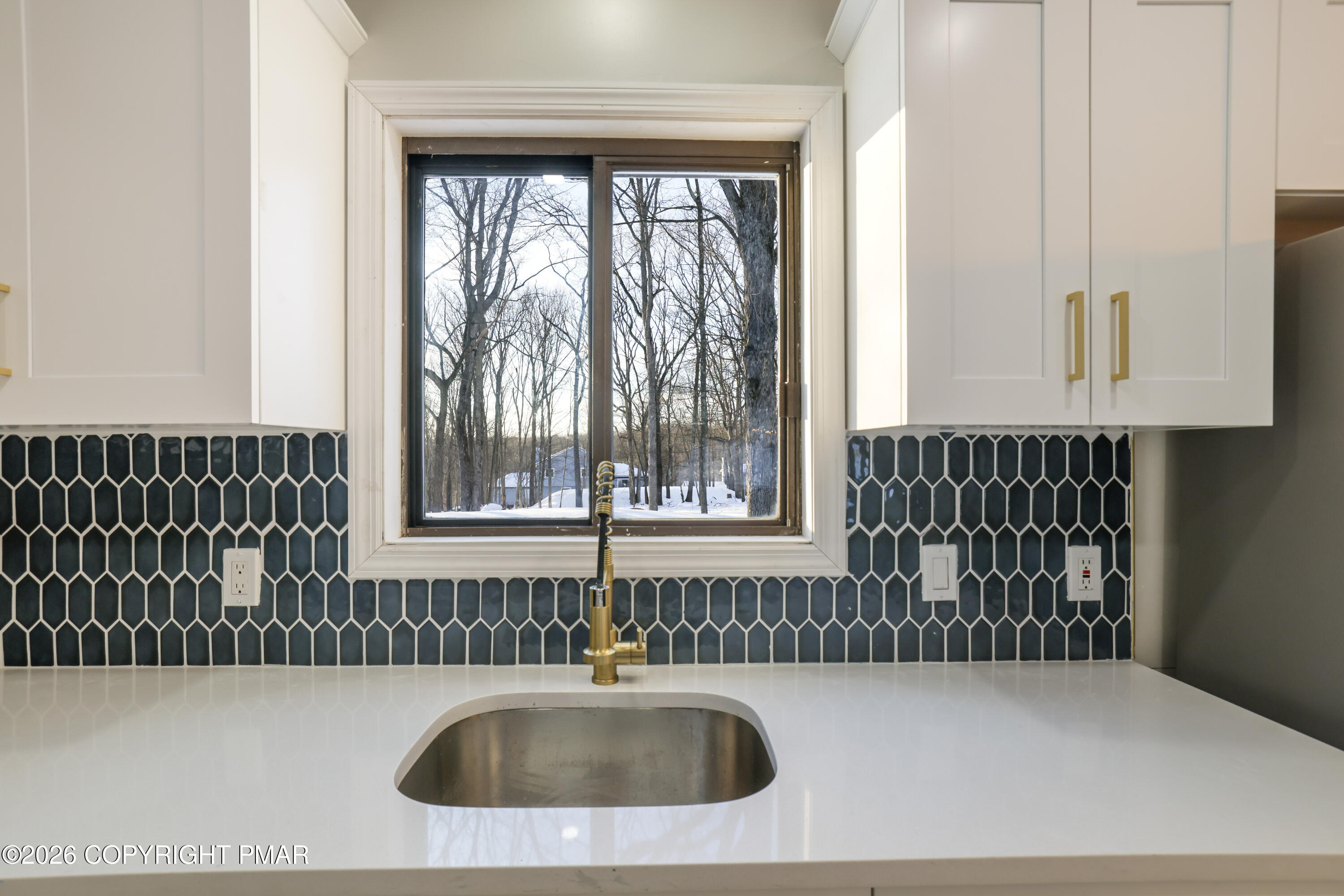 147 Pocono Boulevard Bushkill, PA 18324 - Photo 14 of 38 a bathroom with a sink and a large mirror