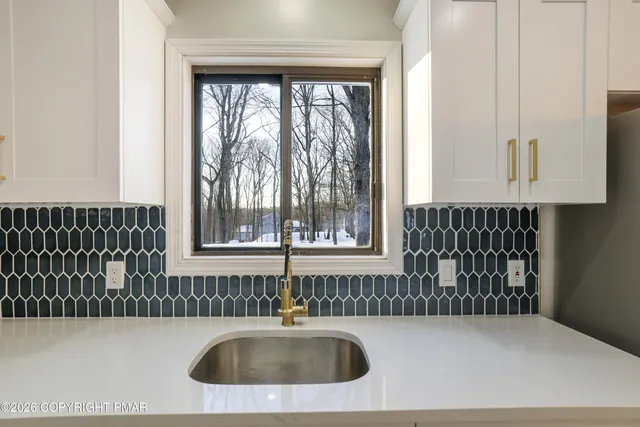 a kitchen with a sink and cabinets