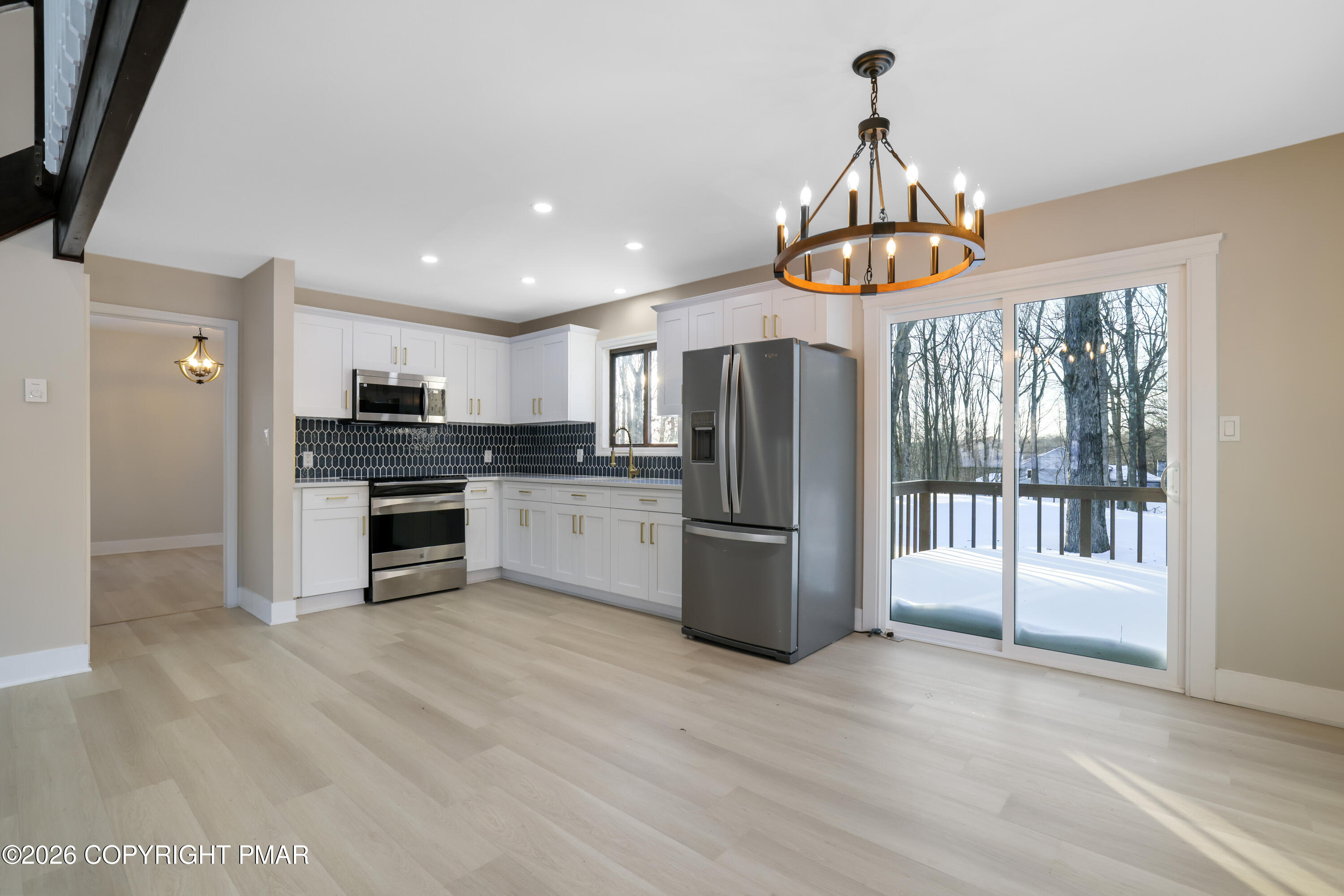 147 Pocono Boulevard Bushkill, PA 18324 - Photo 19 of 38 a view of kitchen with sink microwave and refrigerator