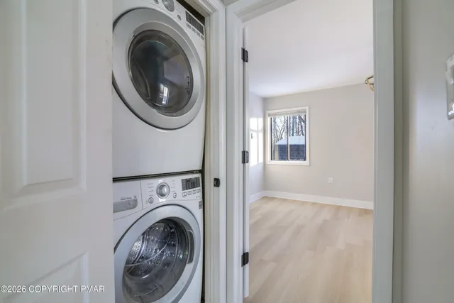 a view of kitchen with sink microwave and refrigerator