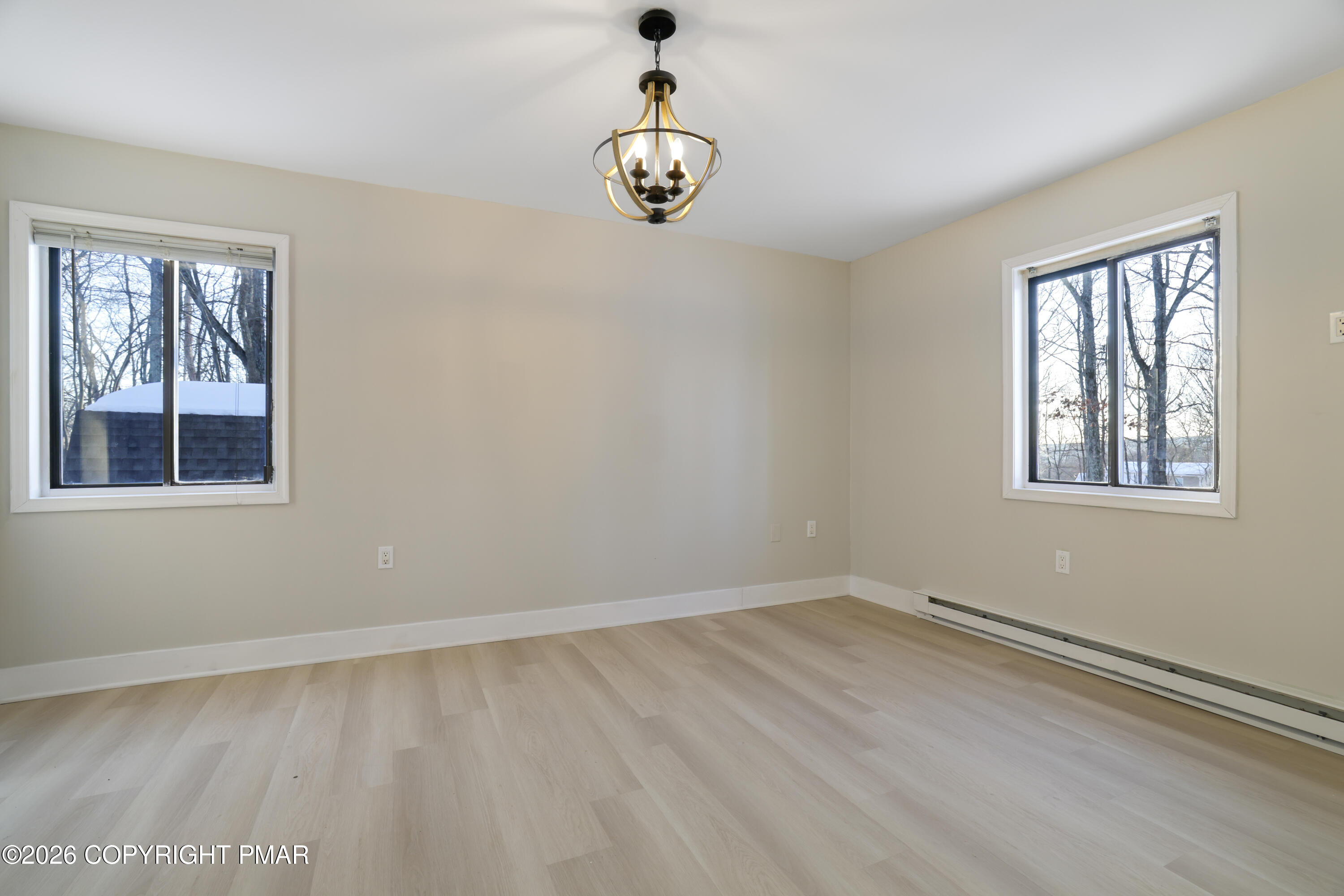 147 Pocono Boulevard Bushkill, PA 18324 - Photo 20 of 38 wooden floor in an empty room with a window