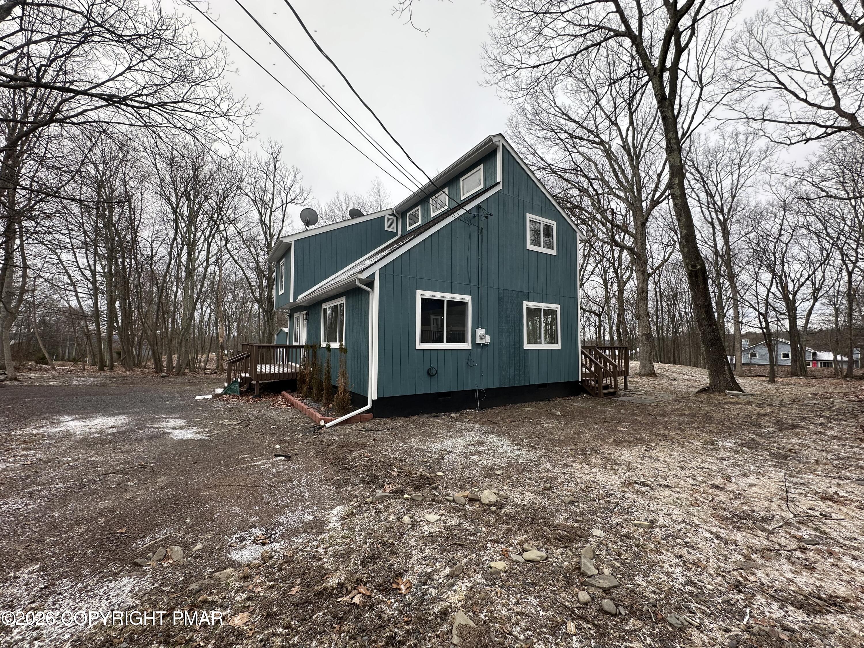147 Pocono Boulevard Bushkill, PA 18324 - Photo 2 of 38 a front view of a house with a yard