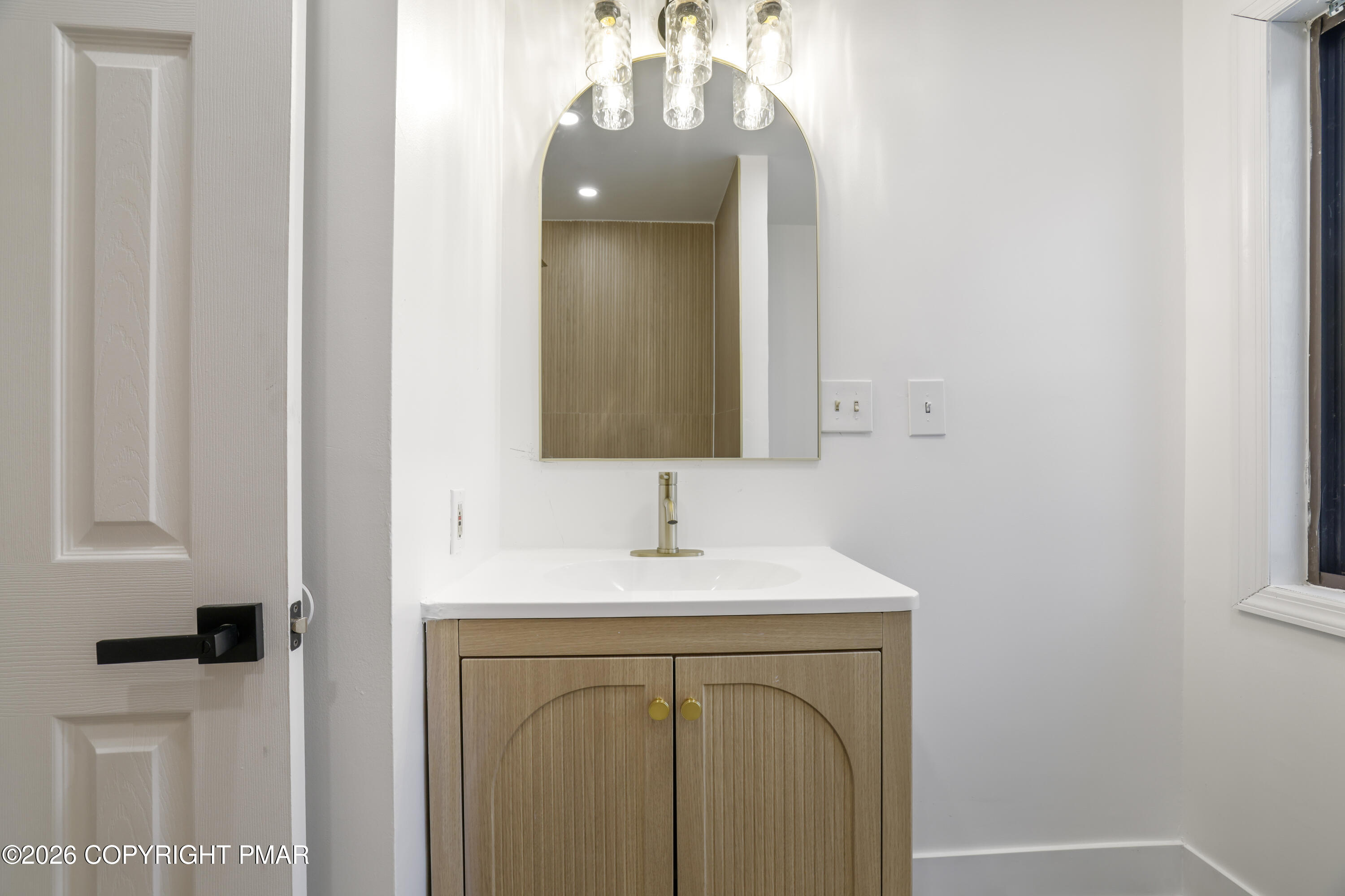 147 Pocono Boulevard Bushkill, PA 18324 - Photo 22 of 38 a bathroom with a sink and a mirror