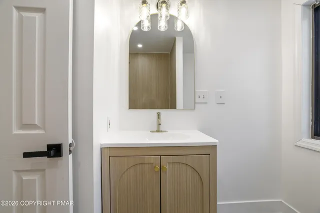 a bathroom with a shower and a toilet