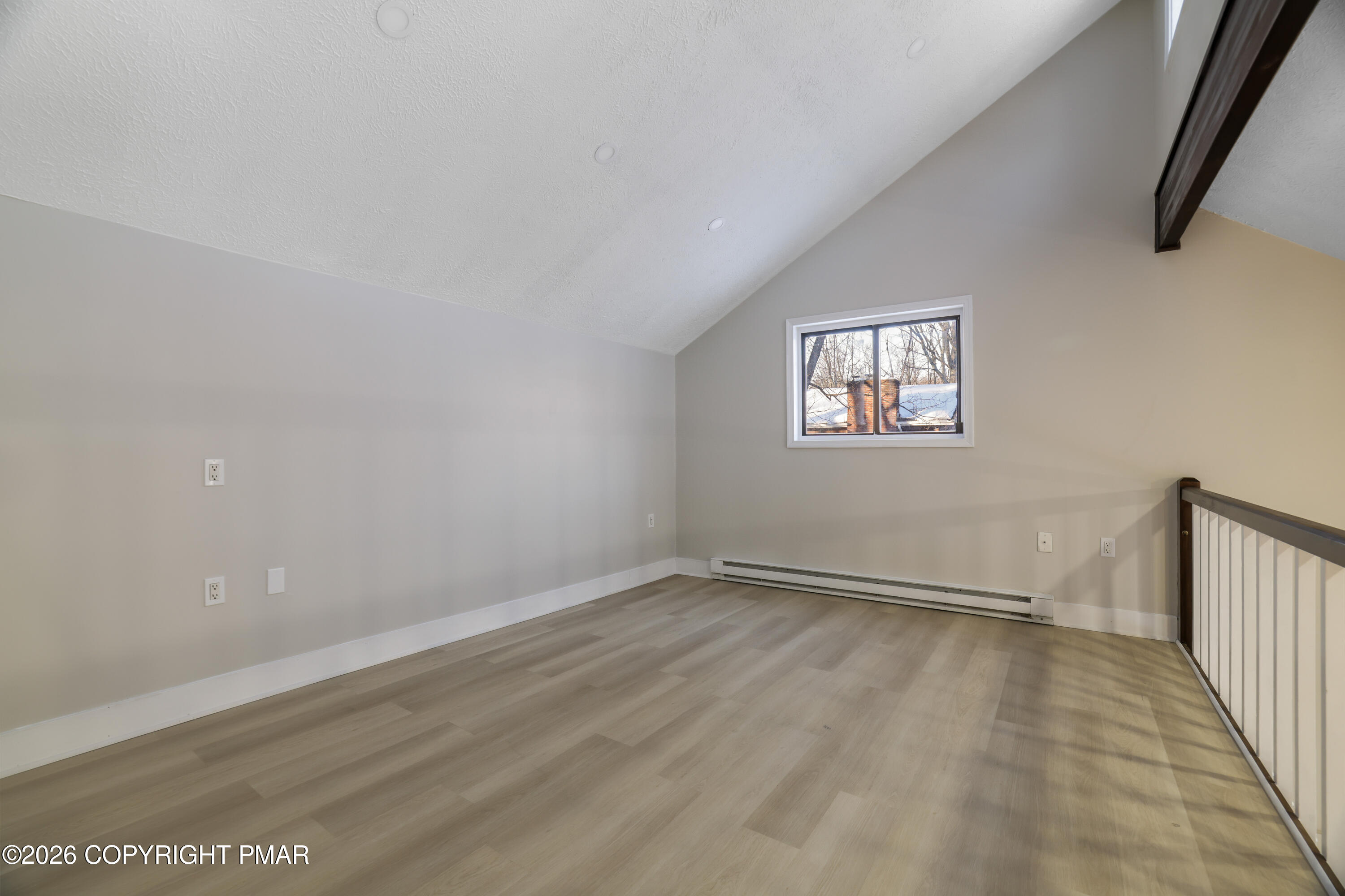 147 Pocono Boulevard Bushkill, PA 18324 - Photo 25 of 38 an empty room with wooden floor and windows