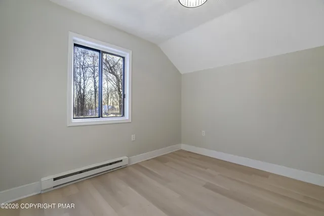 a bathroom with a bathtub toilet and a shower