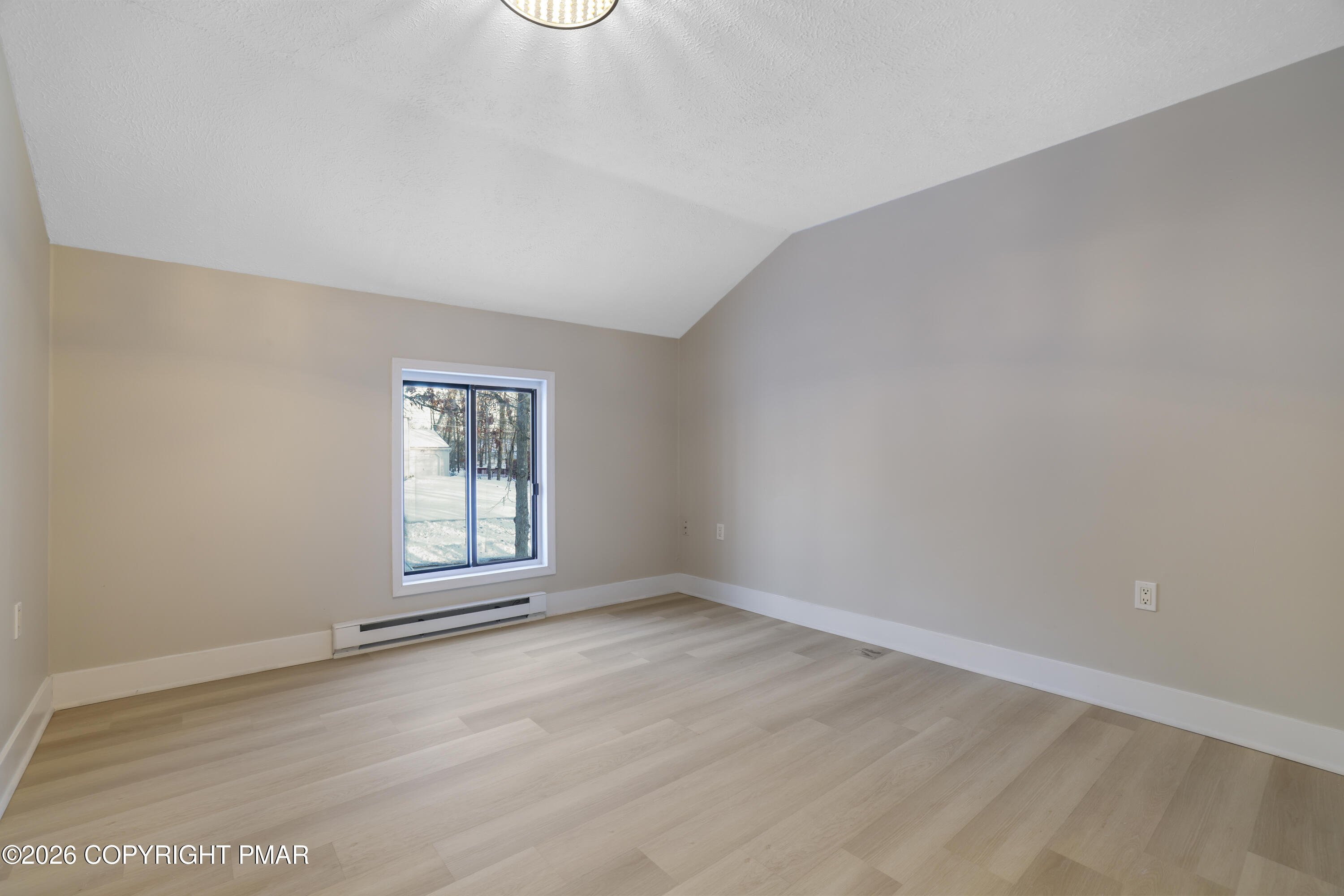 147 Pocono Boulevard Bushkill, PA 18324 - Photo 30 of 38 an empty room with wooden floor and windows