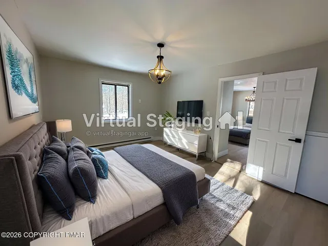 a bedroom with a bed and a mirror