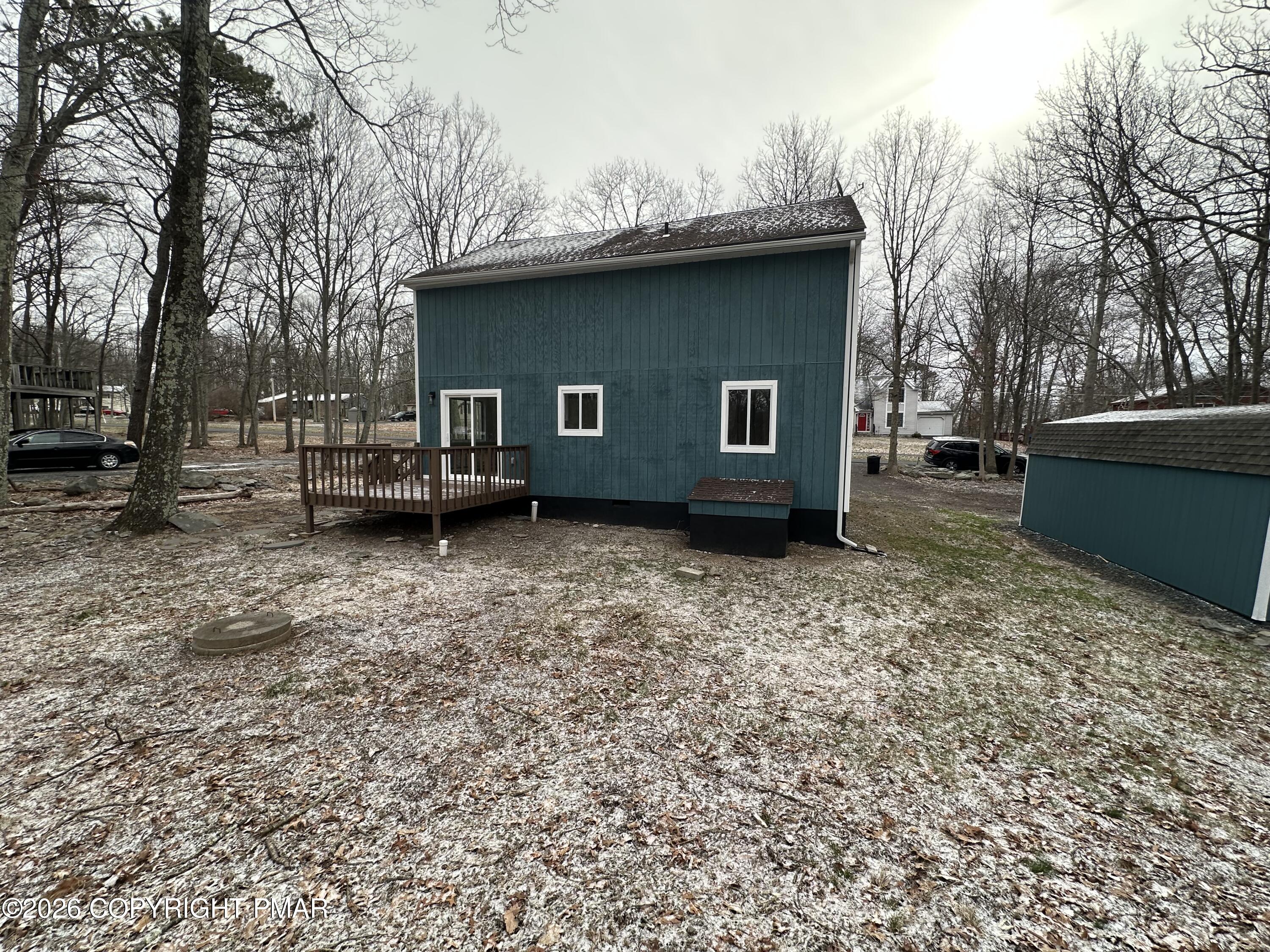 147 Pocono Boulevard Bushkill, PA 18324 - Photo 4 of 38 a backyard of a house with barbeque oven and outdoor seating