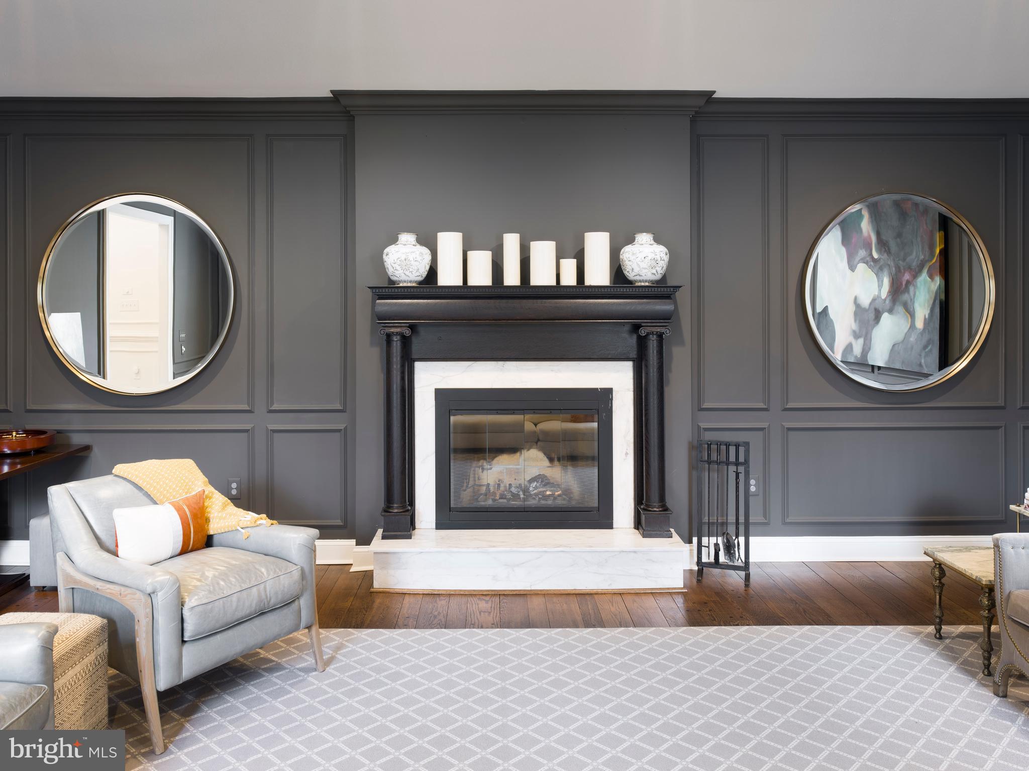 1685 Valley Road Newtown Square, PA 19073 - Photo 15 of 53 a living room with furniture a mirror and a fireplace
