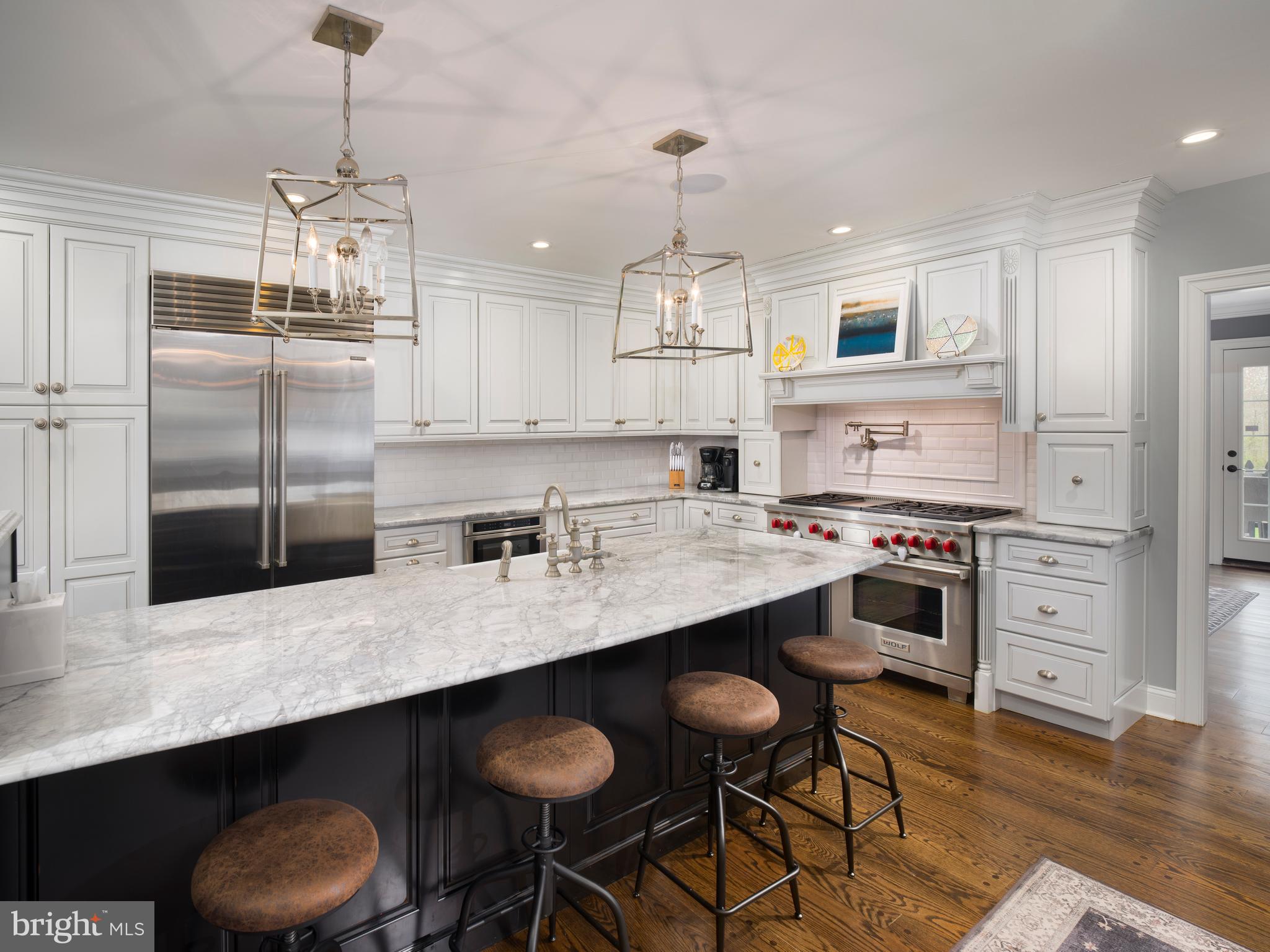 1685 Valley Road Newtown Square, PA 19073 - Photo 21 of 53 a kitchen with stainless steel appliances a sink and stove