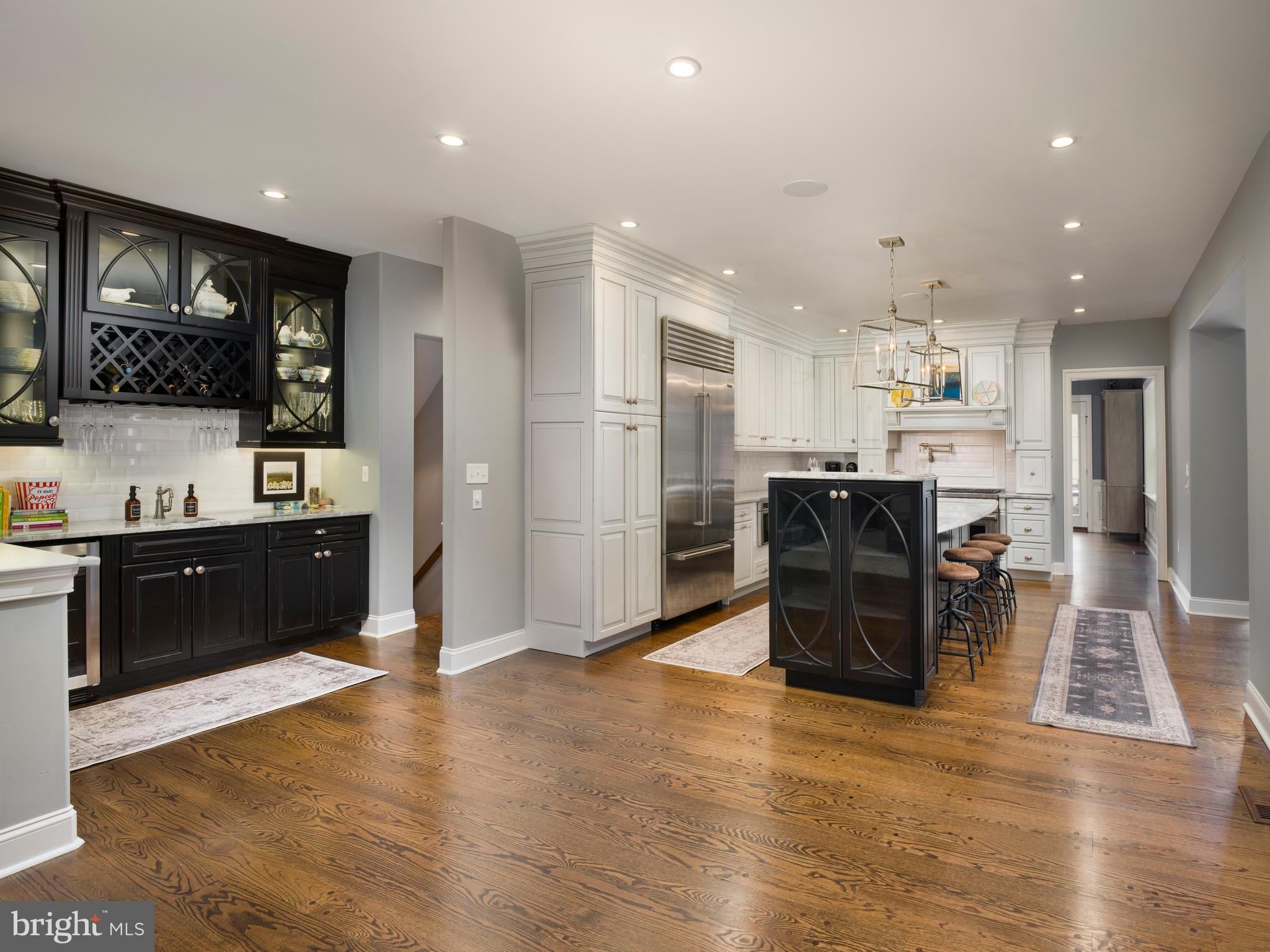 1685 Valley Road Newtown Square, PA 19073 - Photo 24 of 53 a large kitchen with stainless steel appliances kitchen island granite countertop a refrigerator and a stove top oven