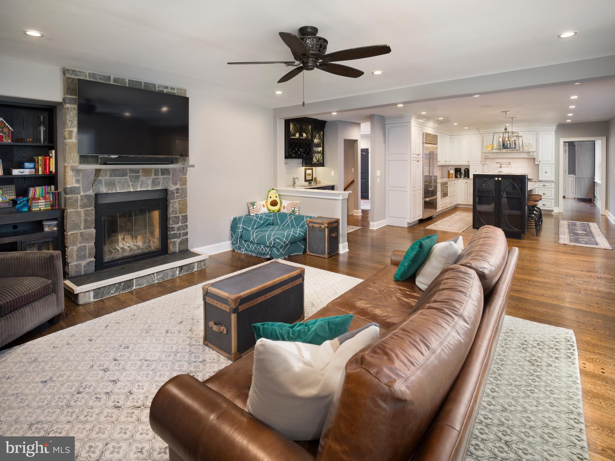 1685 Valley Road Newtown Square, PA 19073 - Photo 28 of 53 a living room with furniture a flat screen tv and a fireplace