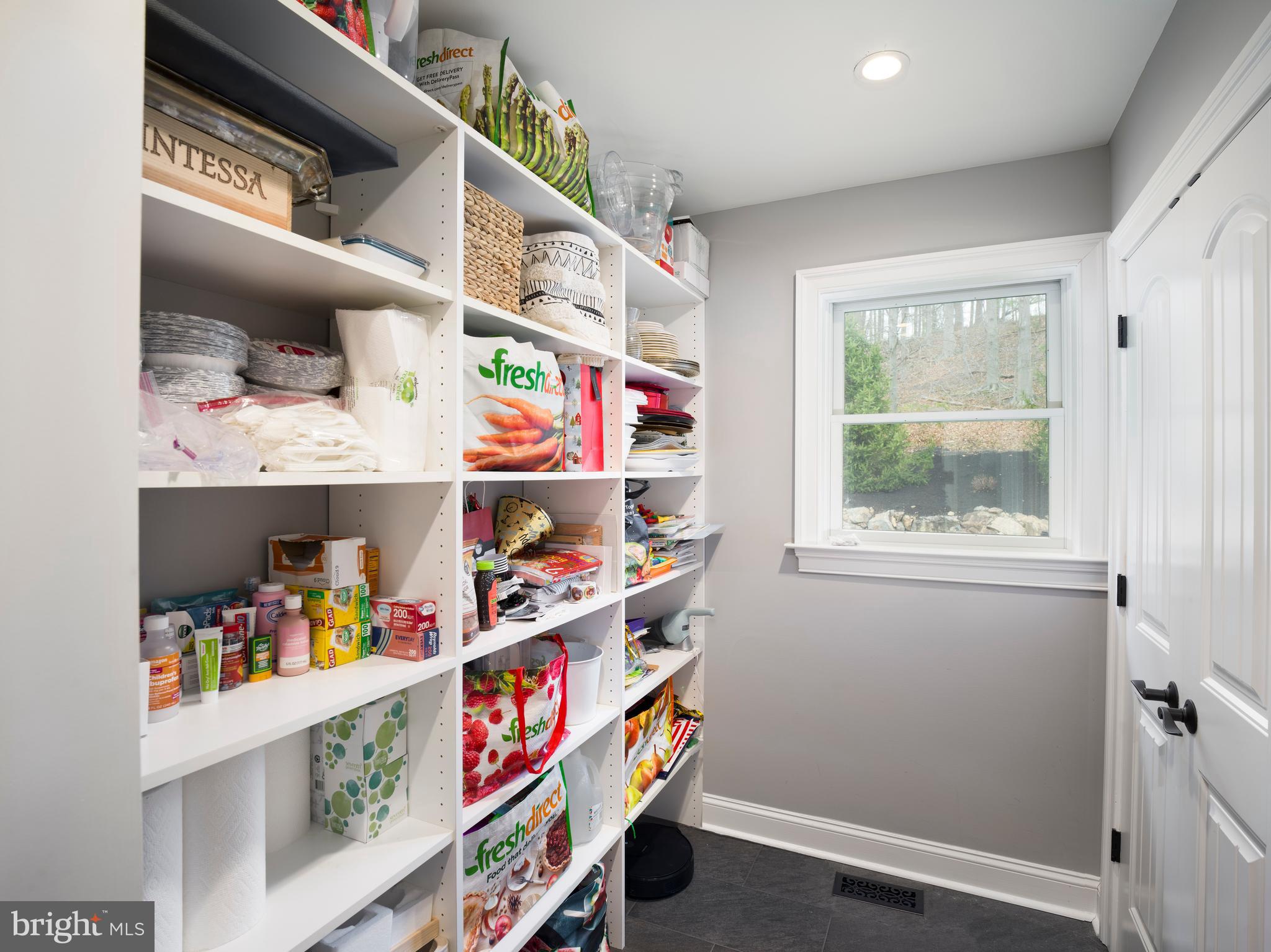 1685 Valley Road Newtown Square, PA 19073 - Photo 30 of 53 a storage room with lots of clutter and cabinets
