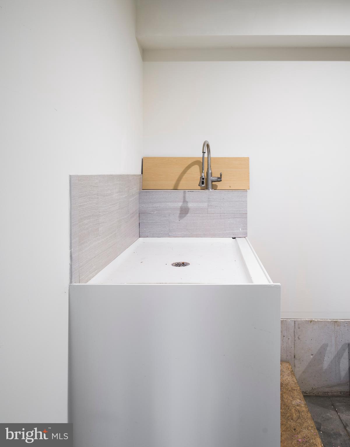 1685 Valley Road Newtown Square, PA 19073 - Photo 32 of 53 a bathroom with a sink and mirror